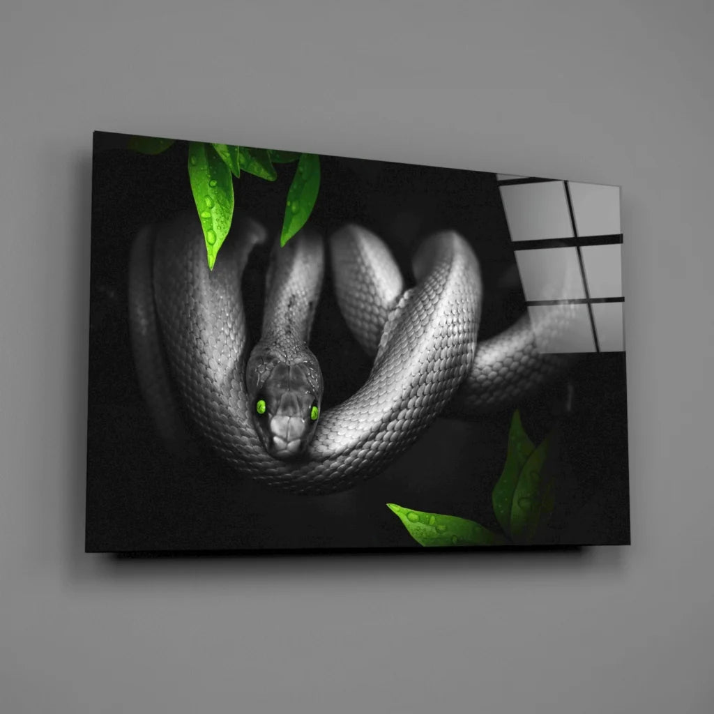 Mystical black snake glass wall art with emerald eyes and green leaves