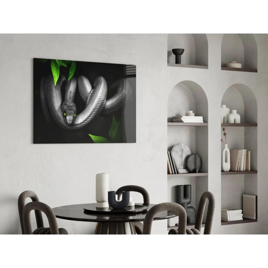 Mystical black snake glass wall art with emerald eyes, green leaves