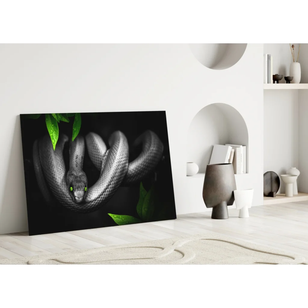 Mystical black snake glass wall art with emerald eyes and green leaves
