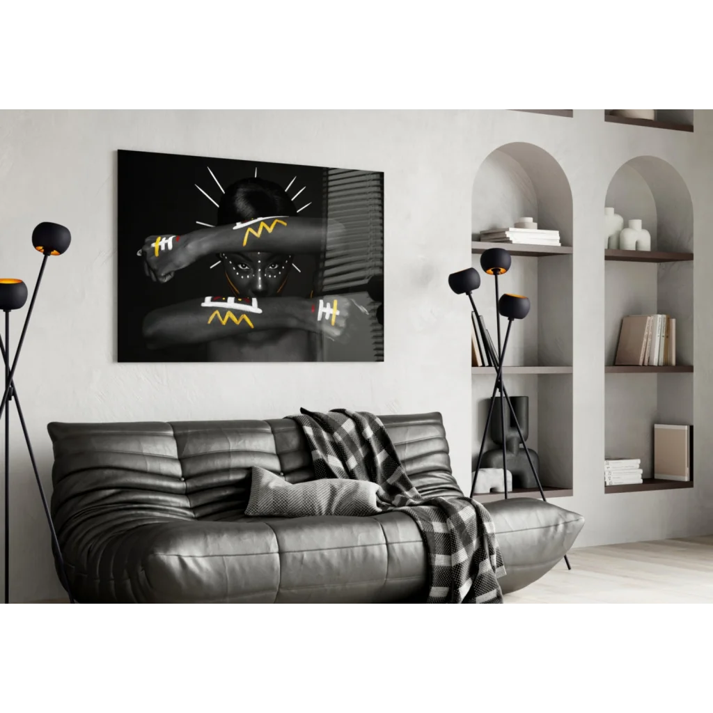 Bold yellow geometric portrait canvas wall art above gray sofa