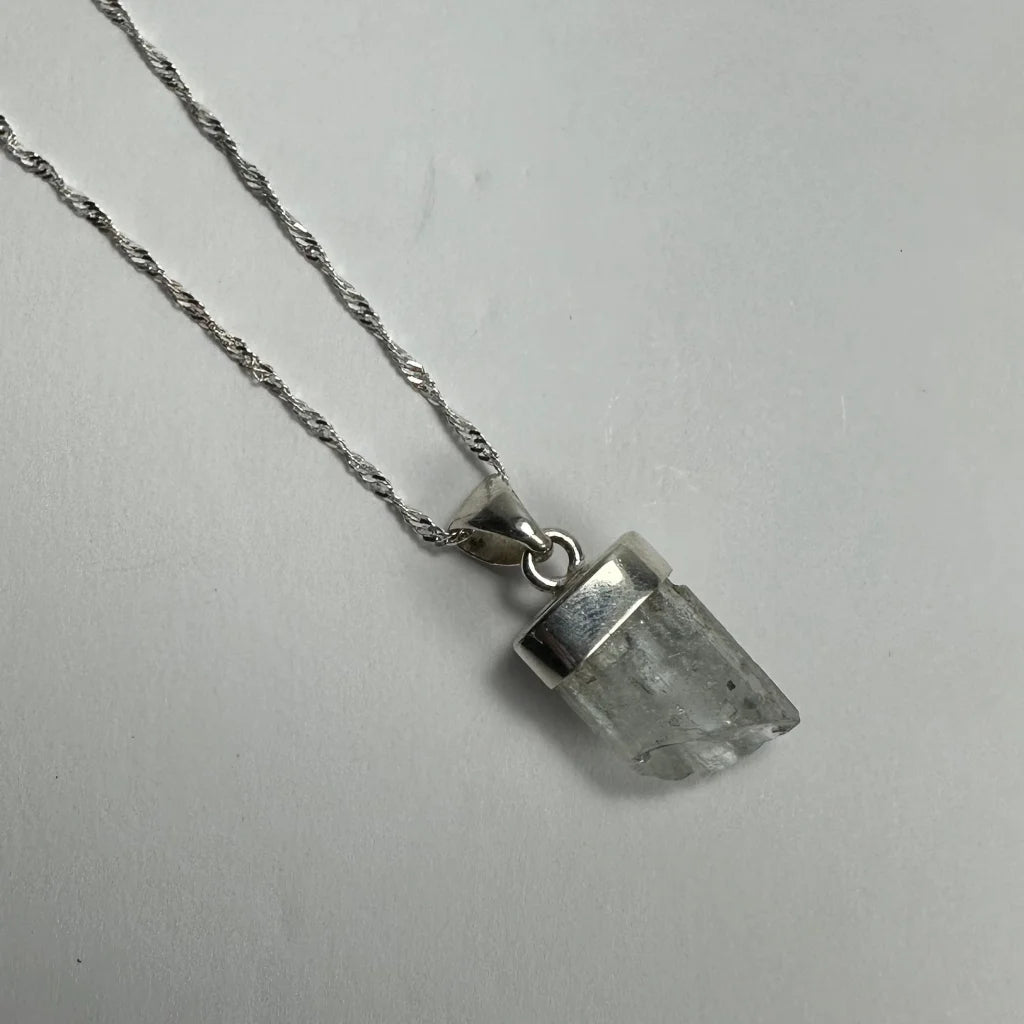 Natural aquamarine beryl sterling silver pendant with raw quartz crystal
