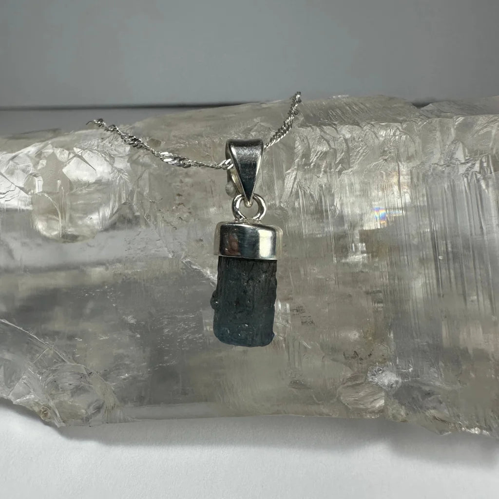Natural aquamarine beryl pendant in silver bezel on chain