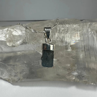 Natural aquamarine beryl pendant in silver bezel on chain