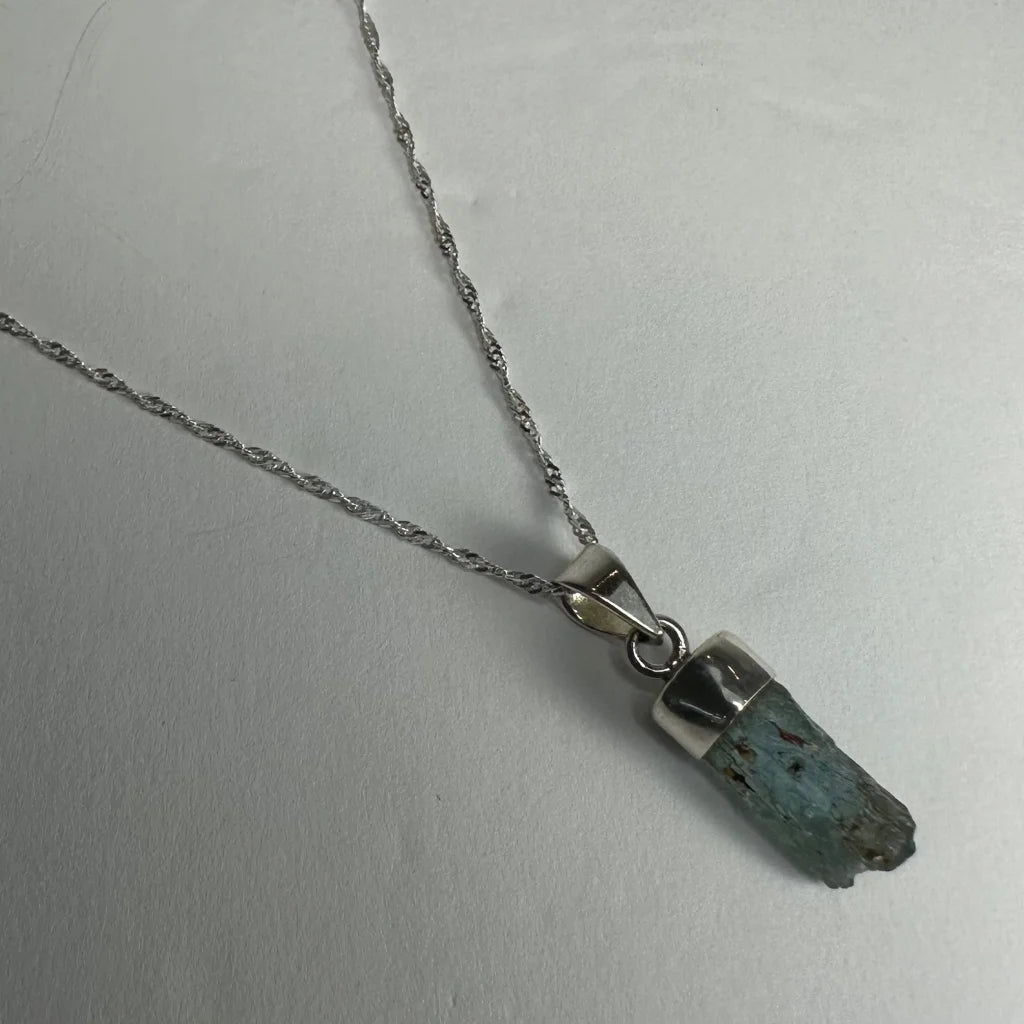 Natural aquamarine beryl sterling silver pendant with raw teal gem