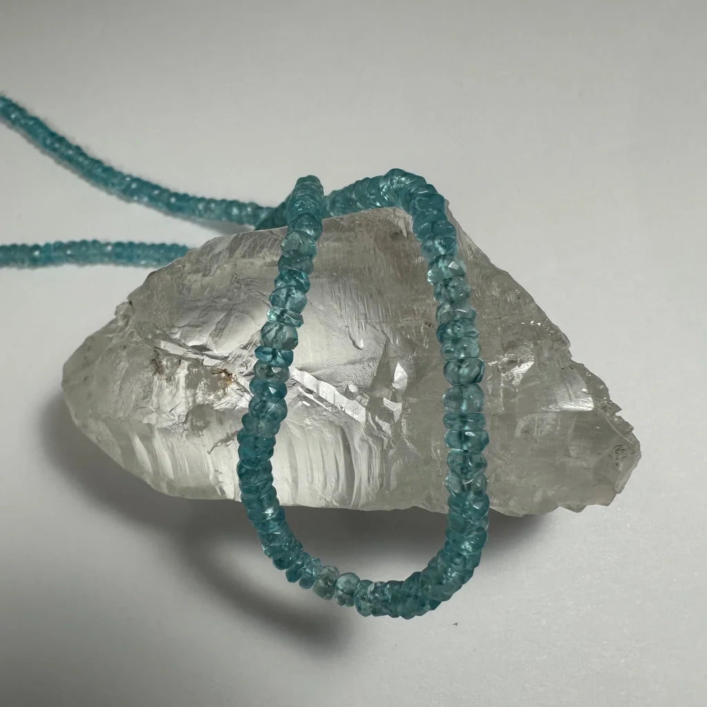 Natural blue apatite necklace with turquoise beads on quartz crystal