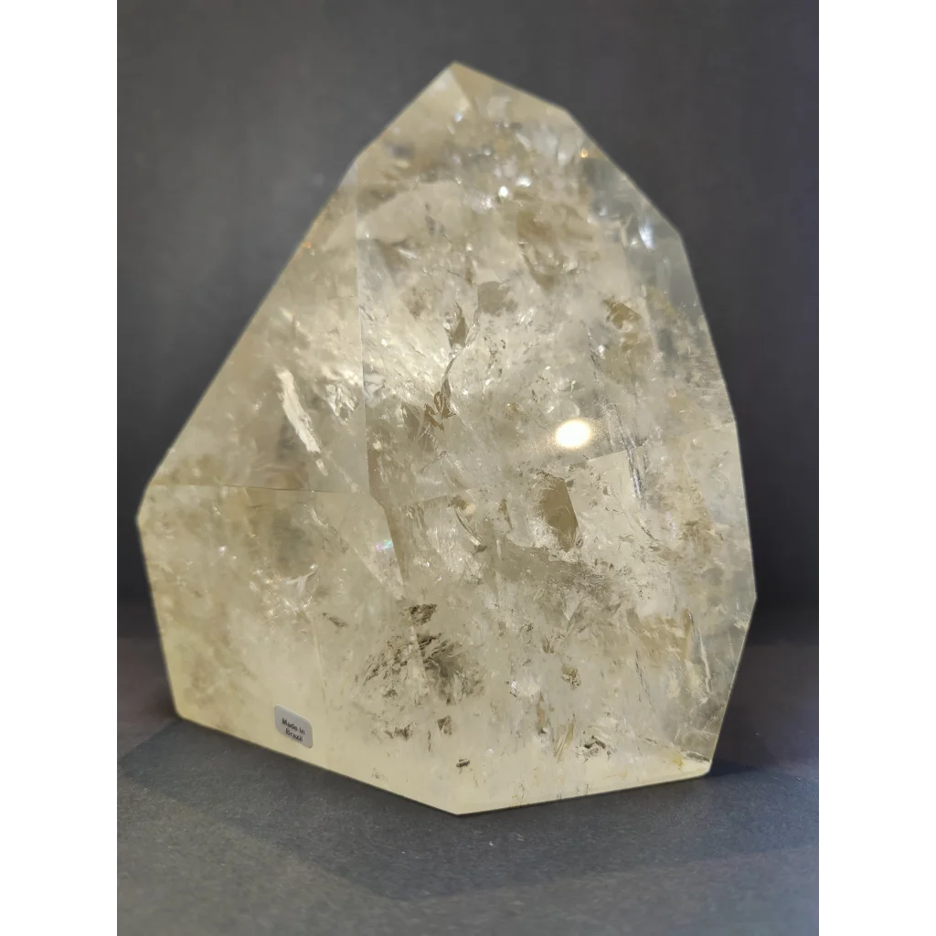 Natural citrine polished point 4.1kg with translucent pale yellow color and rough faceted surface with internal inclusions