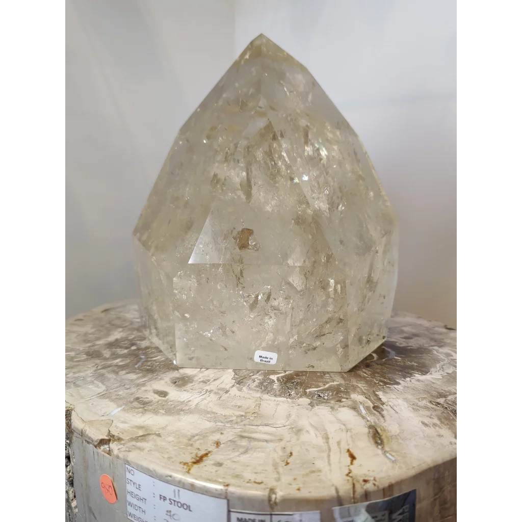 Natural citrine polished point 4.1kg featuring a translucent faceted quartz crystal with natural internal inclusions