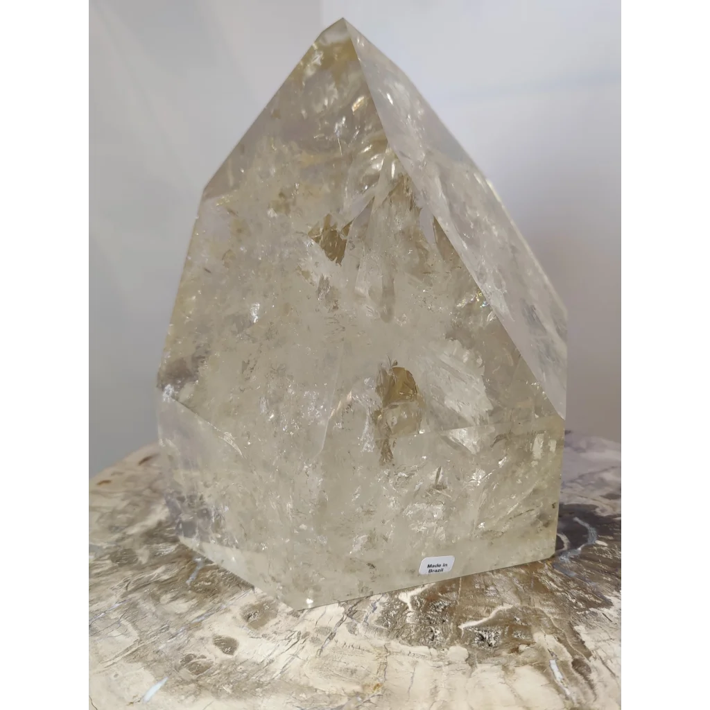 Natural citrine polished point 4.1kg featuring a translucent pale yellow quartz crystal with pointed top and faceted sides