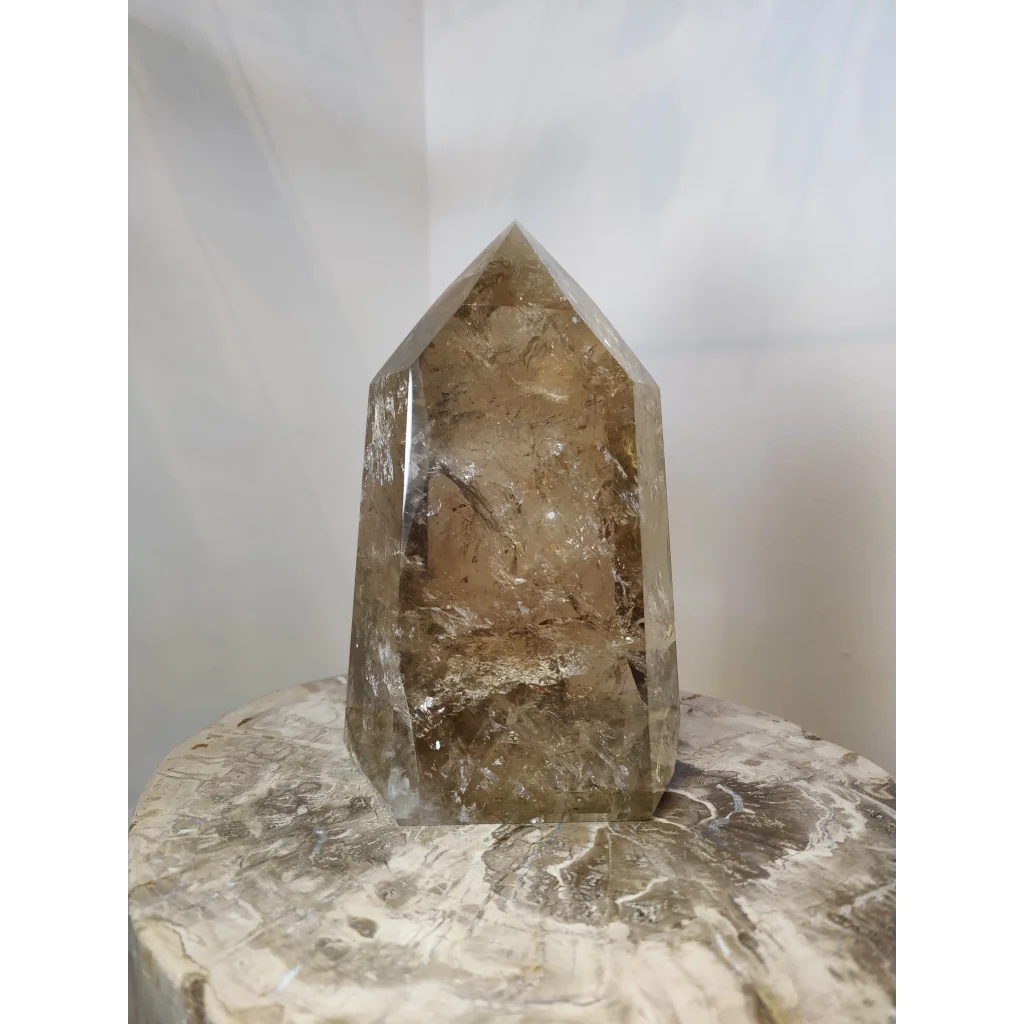 Natural citrine polished point 4.53kg with translucent amber-hued smoky quartz crystal tower and faceted geometric design