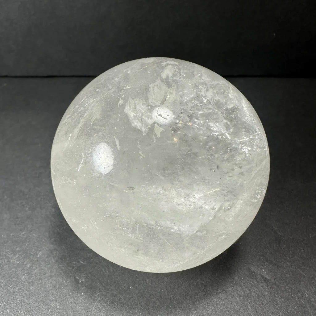 Natural clear quartz sphere with stunning internal inclusions