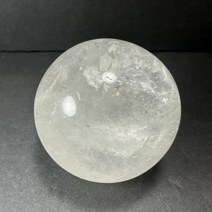 Natural clear quartz sphere with stunning internal inclusions