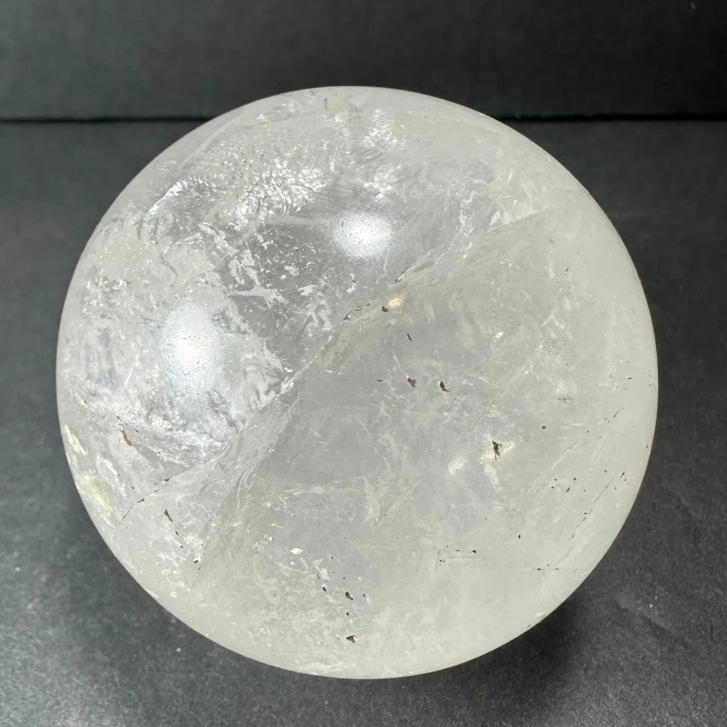 Natural clear quartz sphere with stunning internal inclusions