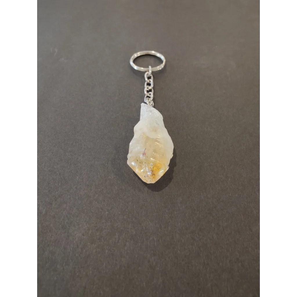 Translucent yellowish citrine crystal keychain with silver ring and chain