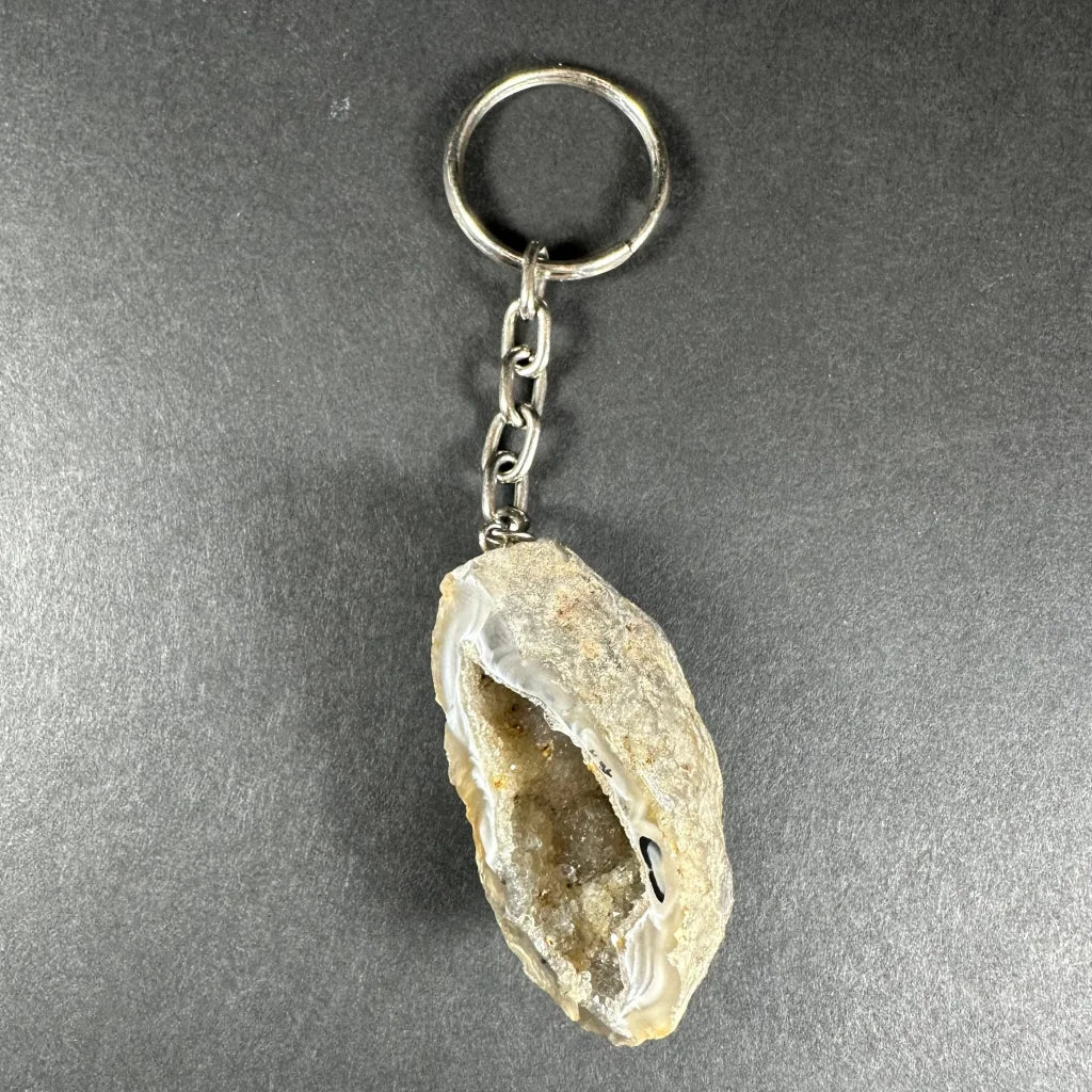 Natural light beige translucent geode crystal keychain with silver ring and chain