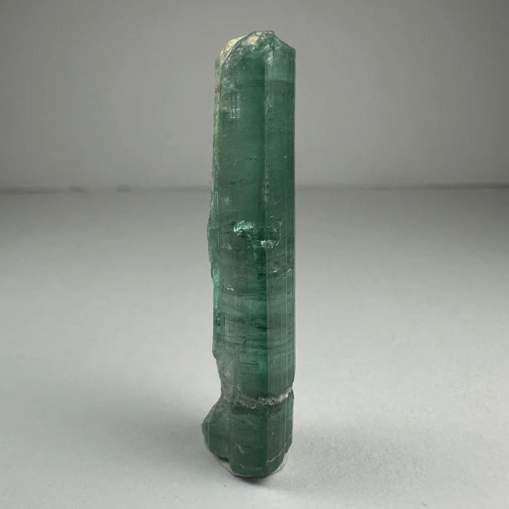 Translucent emerald green indicolite tourmaline crystal with facets