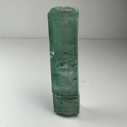 Translucent emerald green indicolite tourmaline gemstone crystal