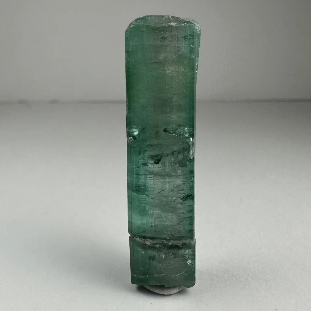 Translucent emerald green indicolite tourmaline gemstone crystal