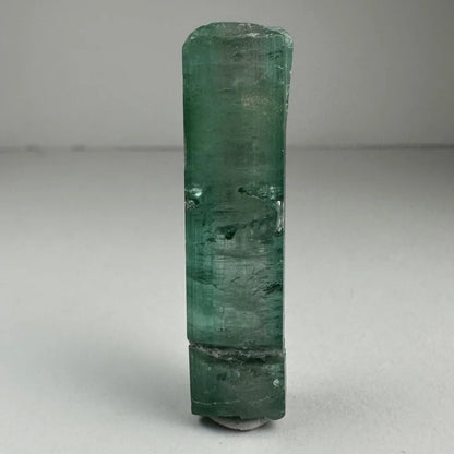 Translucent emerald green indicolite tourmaline gemstone crystal