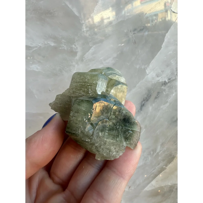Rough green fluorapatite cluster with iridescent crystalline facets