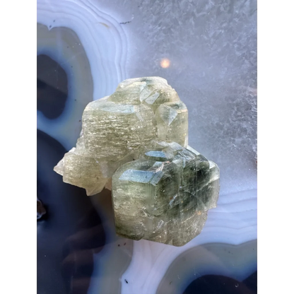 Natural green fluorapatite cluster with translucent crystals and striations
