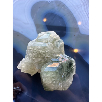 Translucent pale green fluorapatite cluster with angular crystals