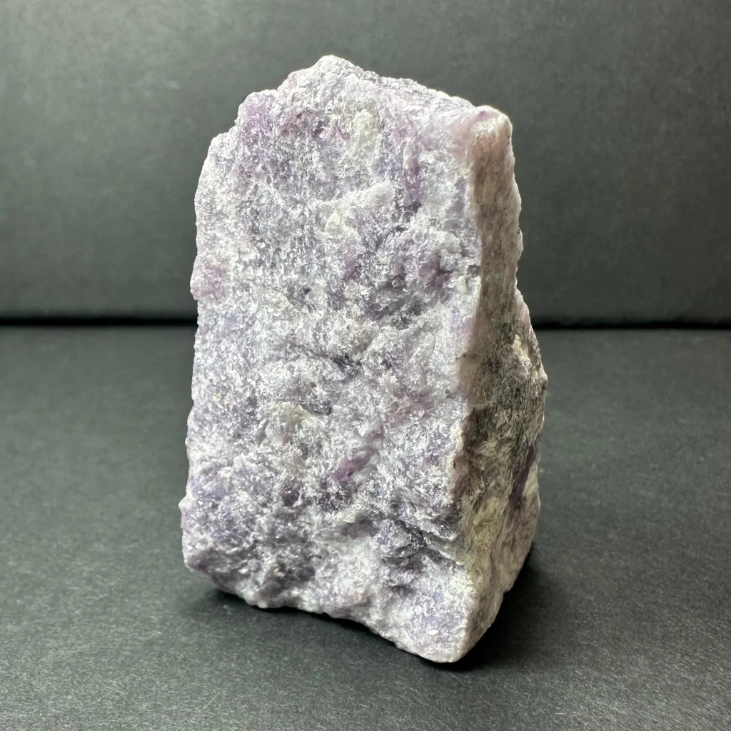 Rough purple lepidolite amethyst geode specimen with textured surface