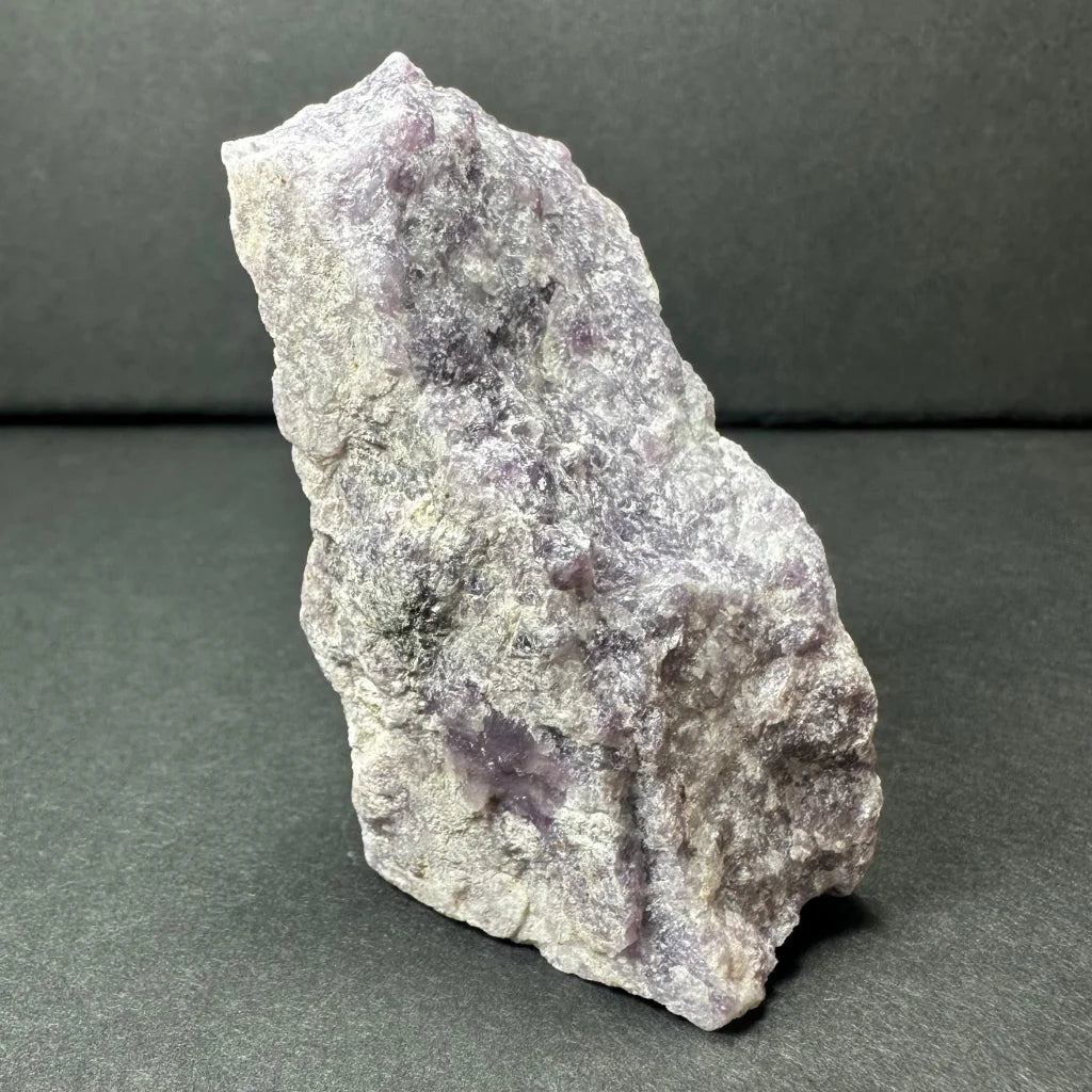 Rough purple lepidolite amethyst geode specimen with translucent crystals