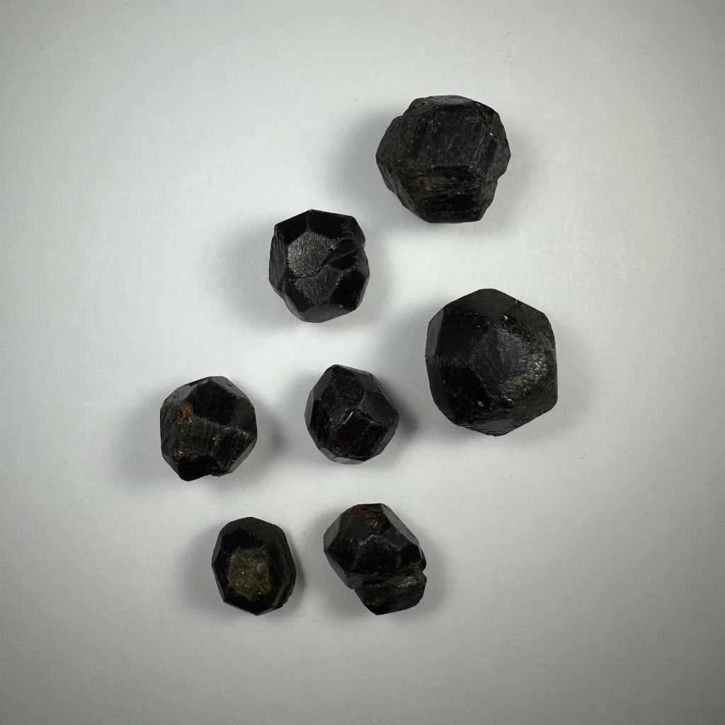Seven glossy black red almandine garnet stones from China