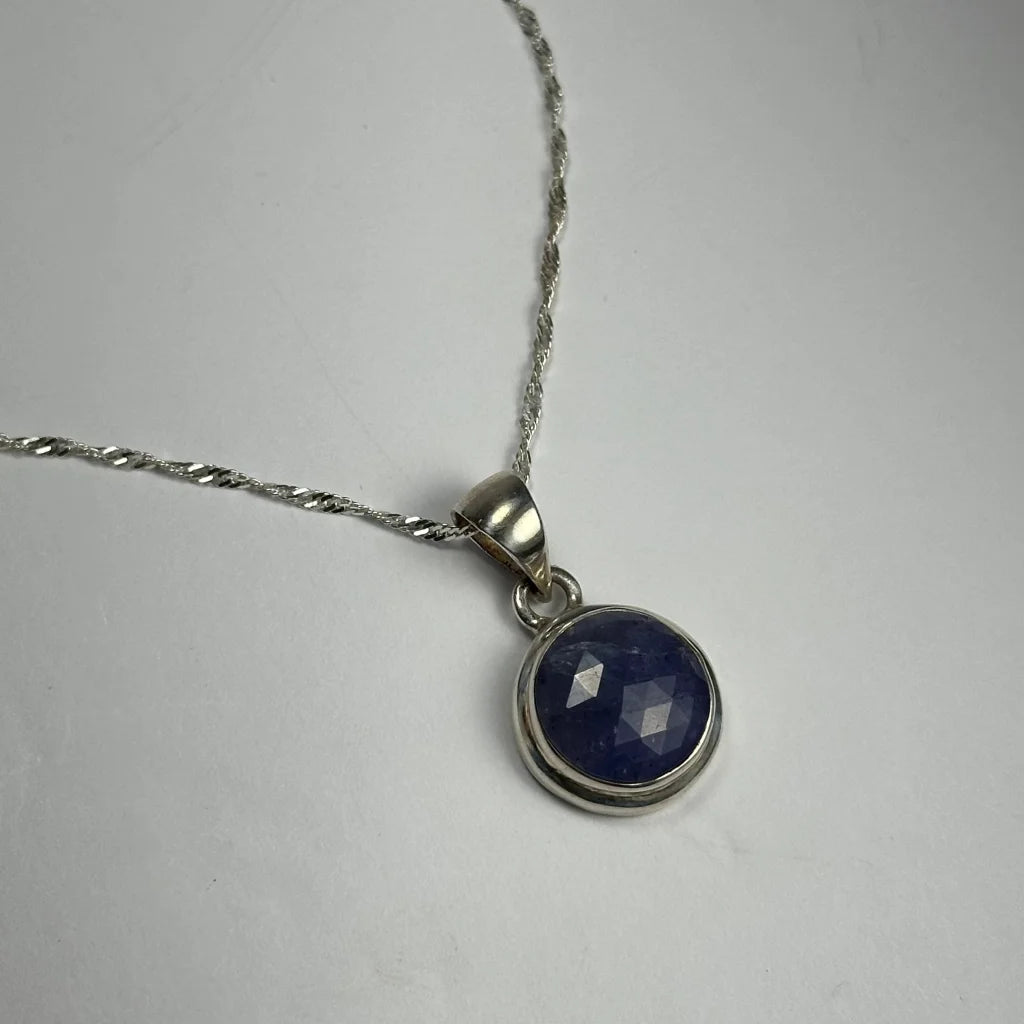 Stunning natural tanzanite pendant in silver bezel setting