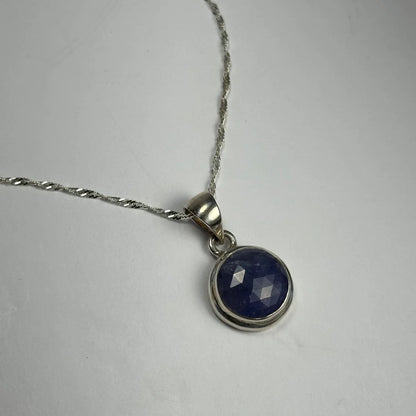 Stunning natural tanzanite pendant in silver bezel setting