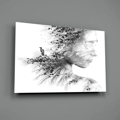 Black-and-white canvas wall art of woman’s profile with tree branches and bird