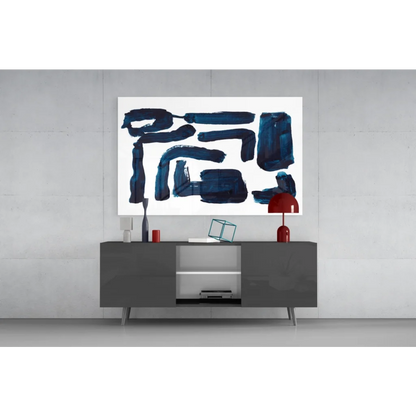 Modern gray sideboard with sleek legs under navy blue geometric glass wall art