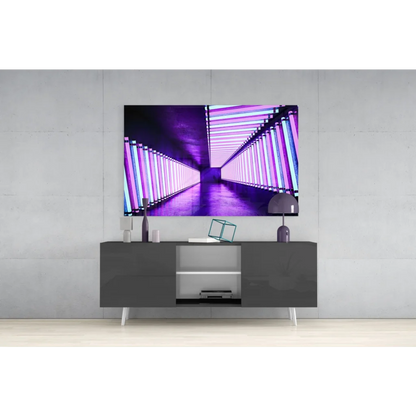 Sleek black console table with white legs under neon purple glass wall art