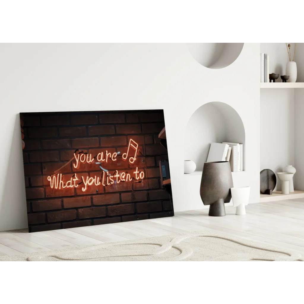 Neon music quote wall art on brick canvas with red you are what you listen to text