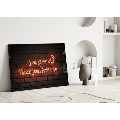 Neon music quote wall art on brick canvas with red you are what you listen to text