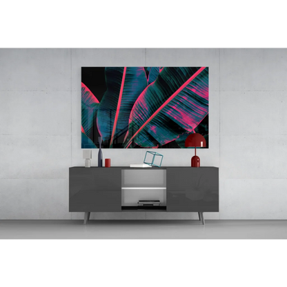 Vibrant neon pink teal banana leaf glass wall art on black background