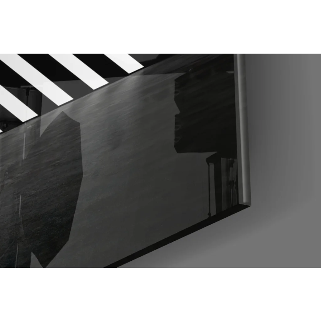 Sleek dark-framed geometric triangle glass wall art in bold black and white