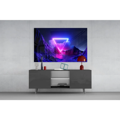Vibrant neon triangle glass wall art with purple pink glow over dark mountains