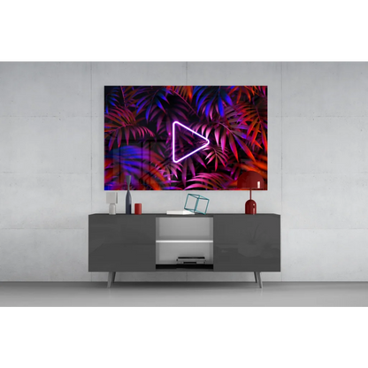 Vibrant 4K smart TV glass wall art with neon triangle play button on tropical leaves