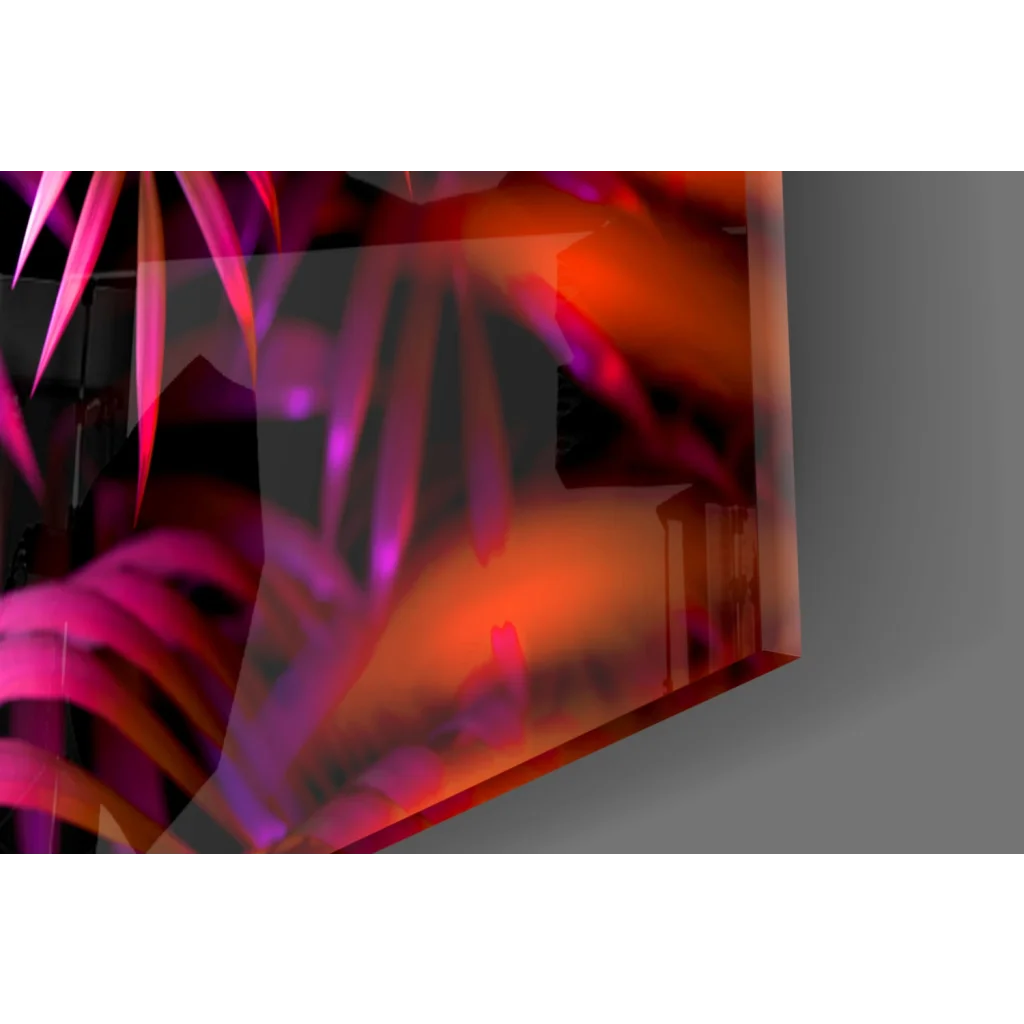 Orange black abstract art print on glass wall art with neon triangle play button on tropical leaves