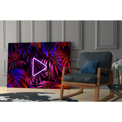 Vibrant neon triangle play button glass wall art on tropical leaves, purple pink hues