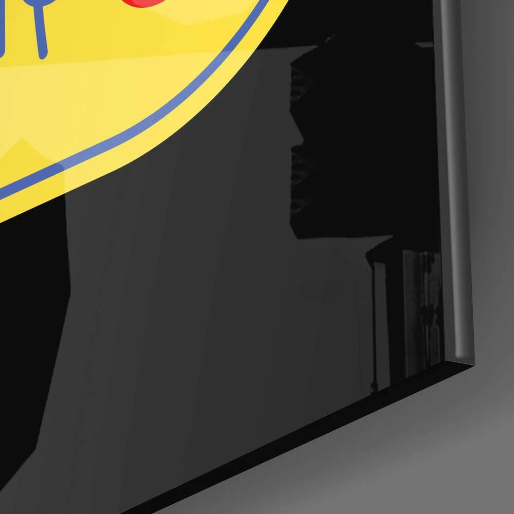 Never Give Up yellow circular glass wall art logo