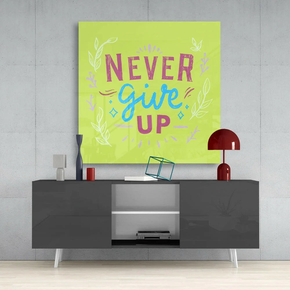 Lime green glass wall art with Never Give Up in pink blue lettering