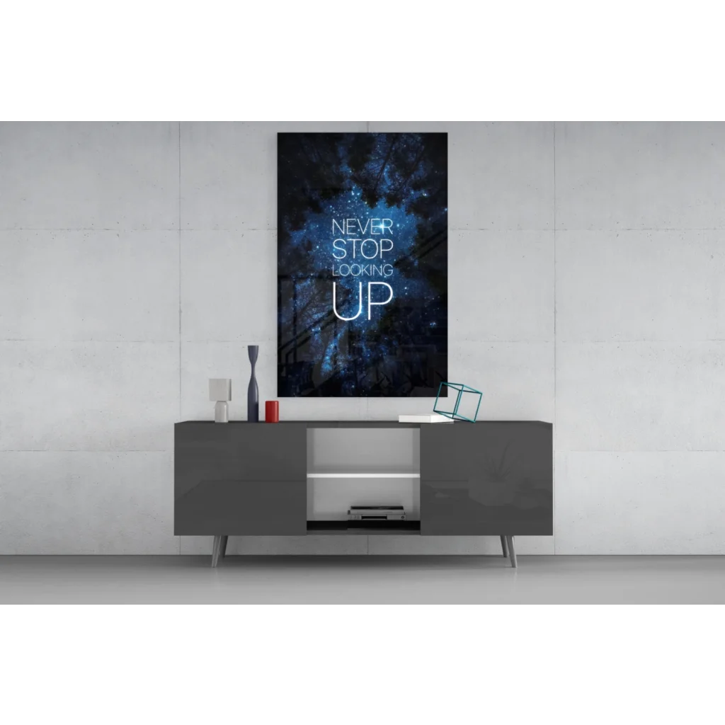 Sleek black glossy sideboard with starry sky glass wall art