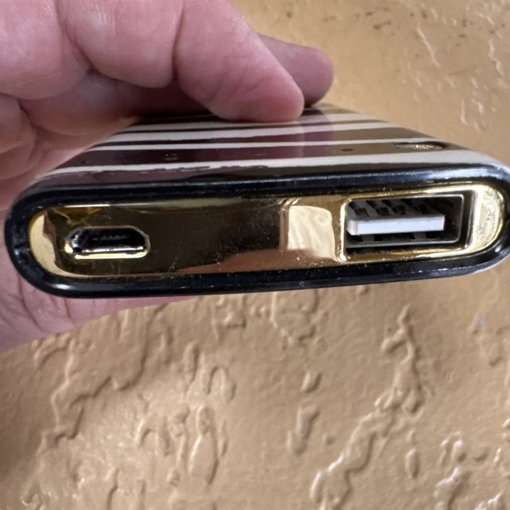 Kate Spade New York backup battery bank with gold-trimmed black case