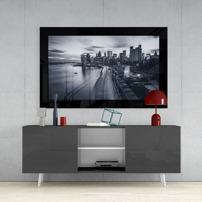 Black-framed TV showing monochrome cityscape glass wall art