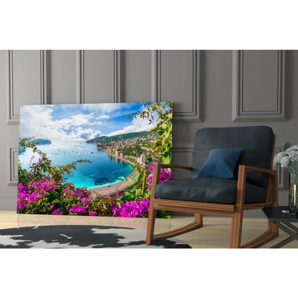 Vibrant glass wall art of turquoise coastal waters and purple bougainvillea
