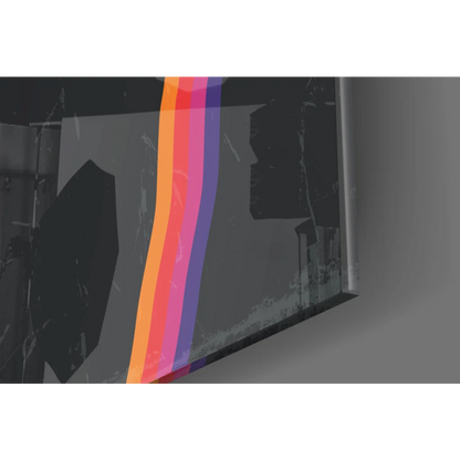Vibrant rainbow gradient glass wall art with orange pink purple stripes on textured gray surface