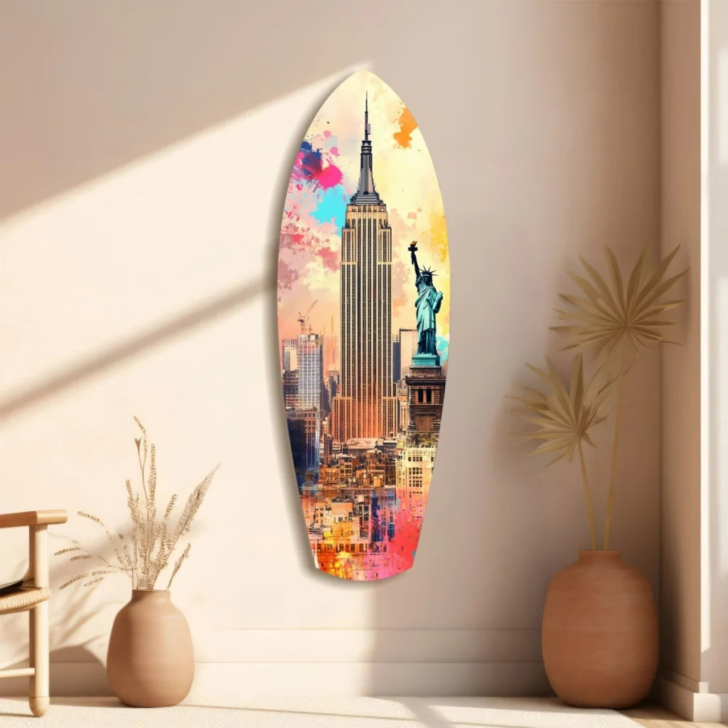 Vibrant NYC surfboard tempered glass art with size comparison, colorful Empire State Building and Statue of Liberty cityscape in pink, blue, orange, yellow hues