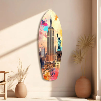 Vibrant NYC surfboard tempered glass art with size comparison, colorful Empire State Building and Statue of Liberty cityscape in pink, blue, orange, yellow hues